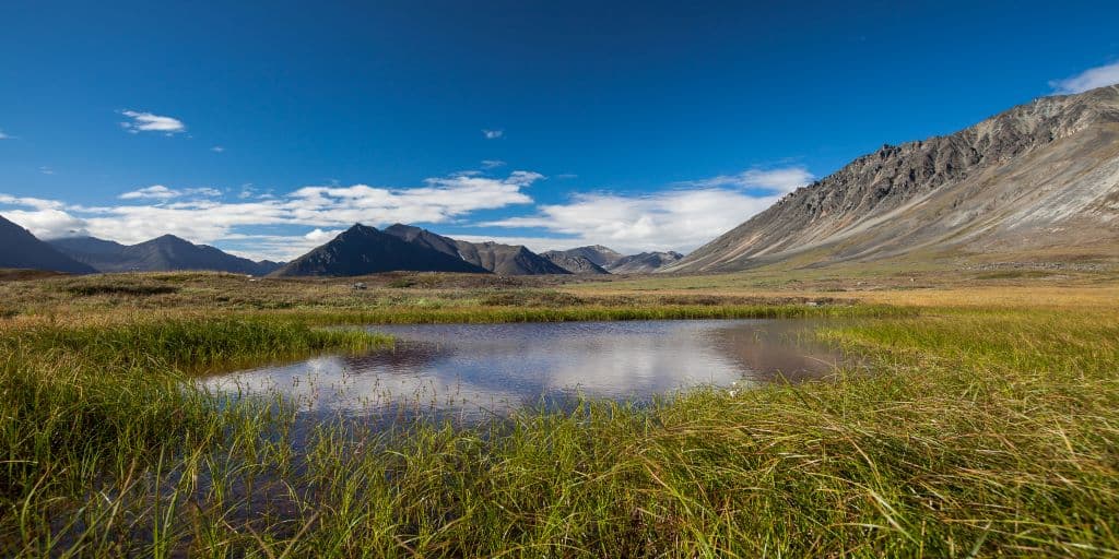 A peaceful mountain lake that evokes feelings of calm and encouragement.